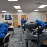 Associates working at computers in an IT classroom.