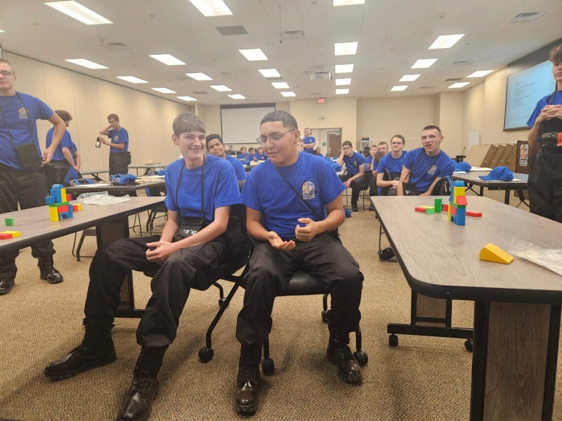 Associates participate in team-building activities: Indoor partner activity using building blocks