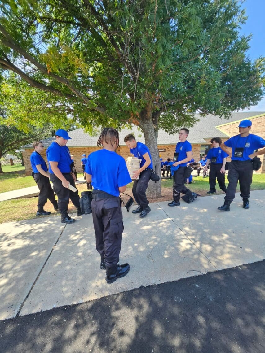 Associates participate in team-building activities: Outdoor Jenga