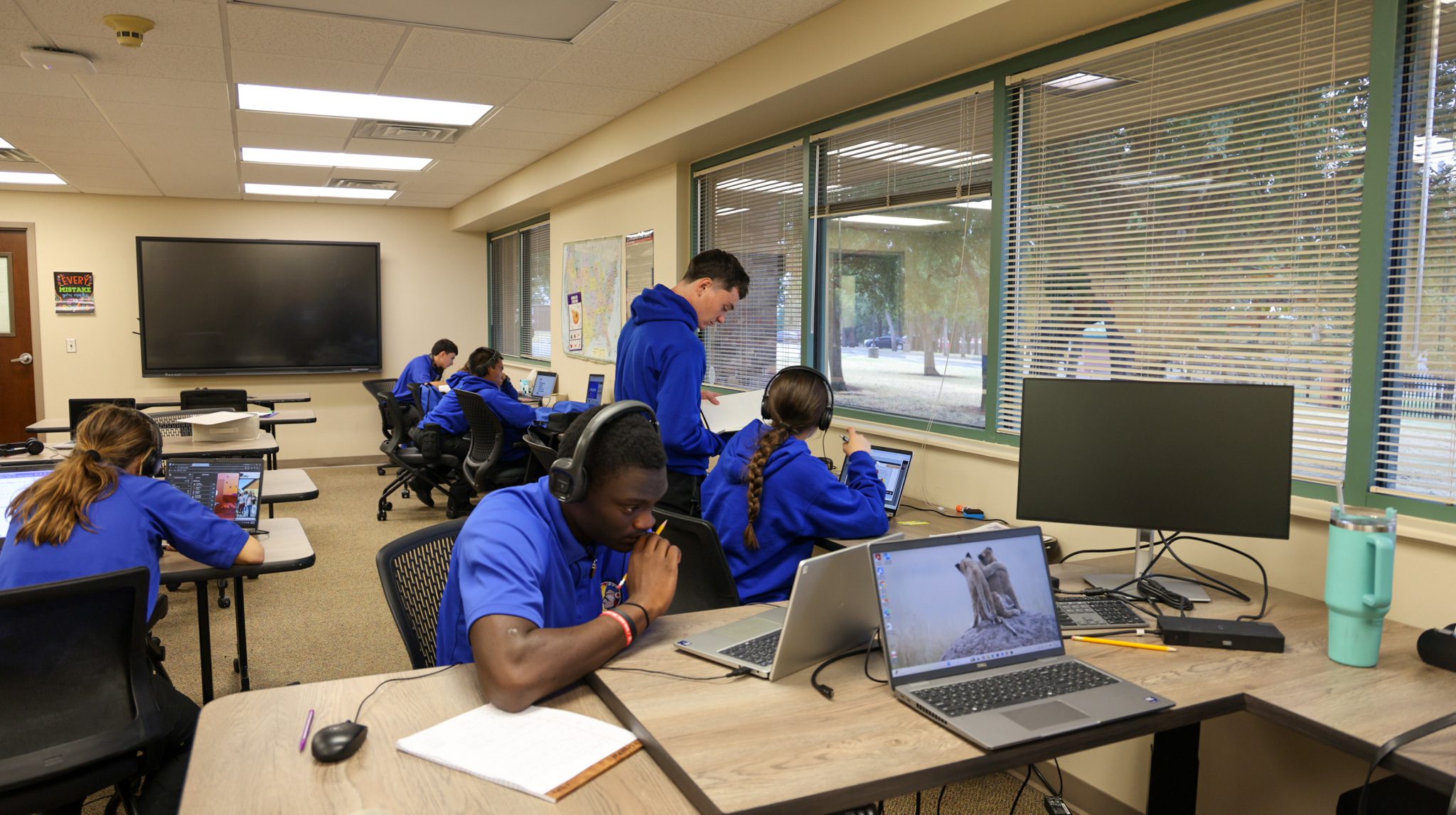 Group of students in a classroom studying.