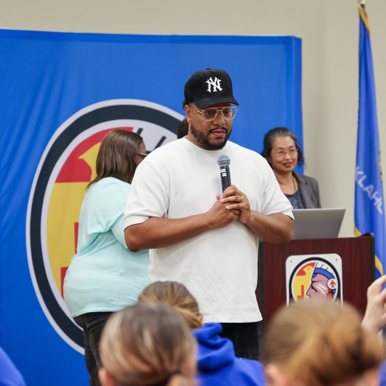 Man speaking to a group of students.